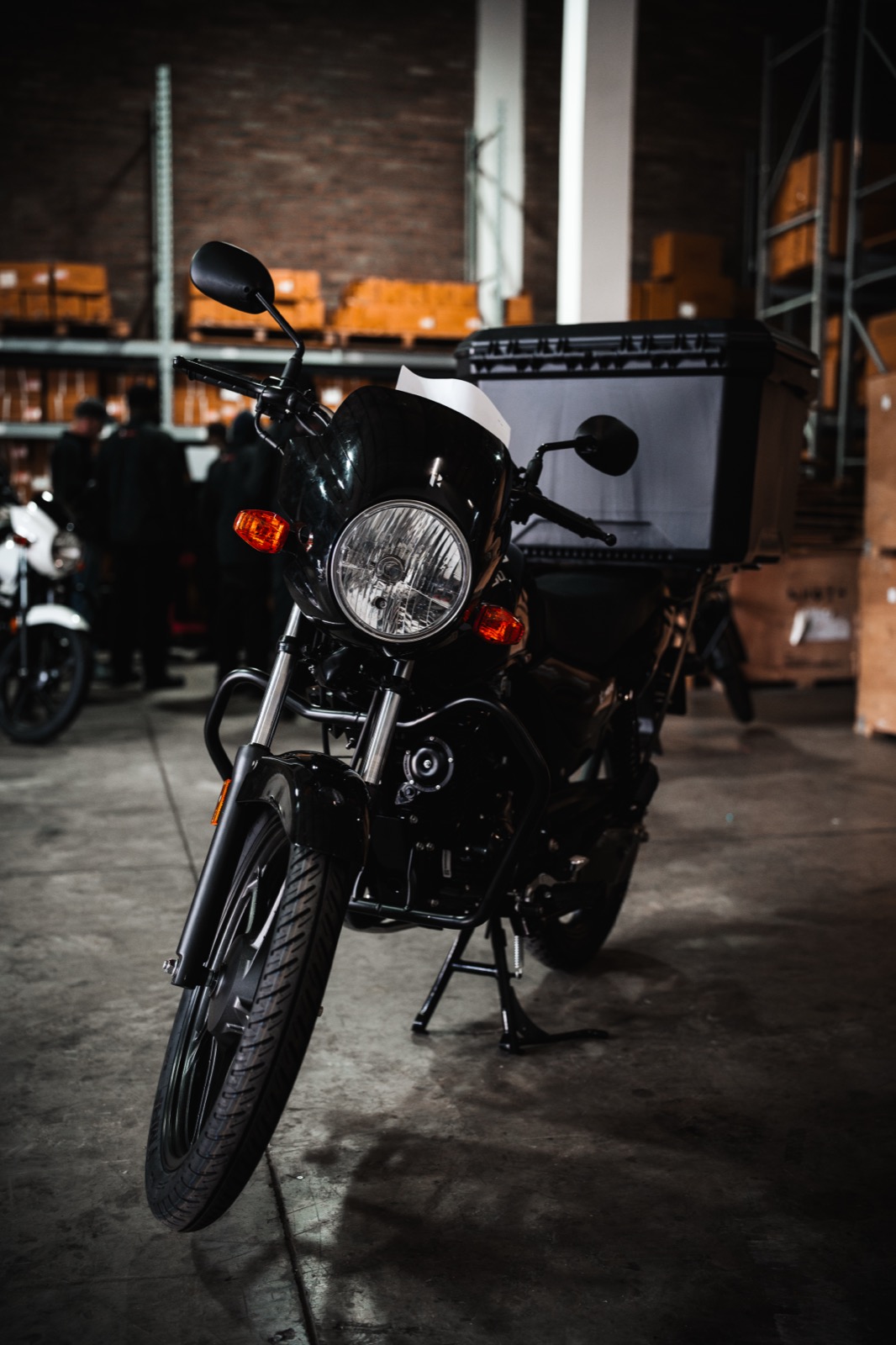 Technician checking a Hero motorcycle in the workshop
