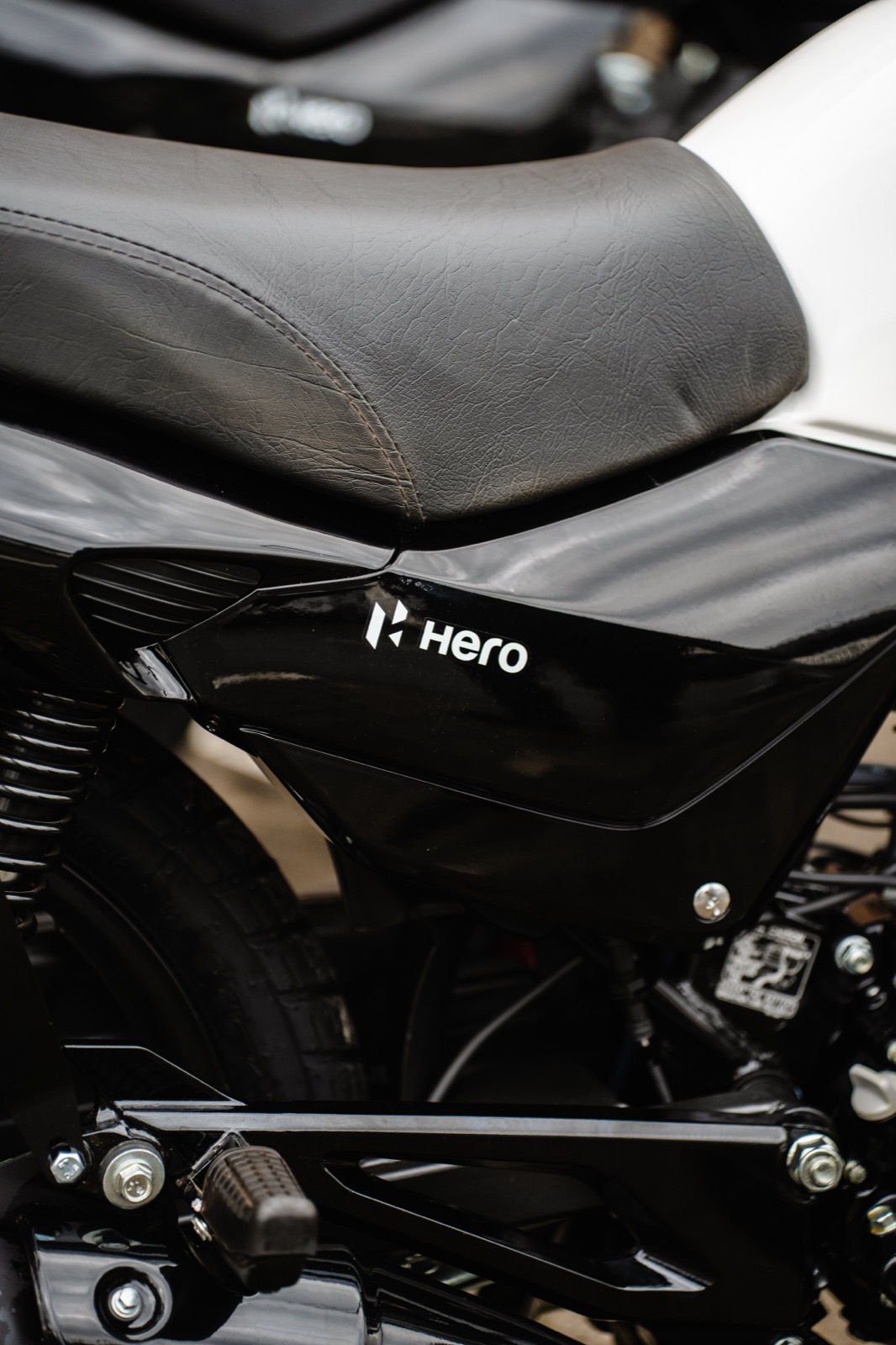 Delivery rider on a Hero motorcycle in motion